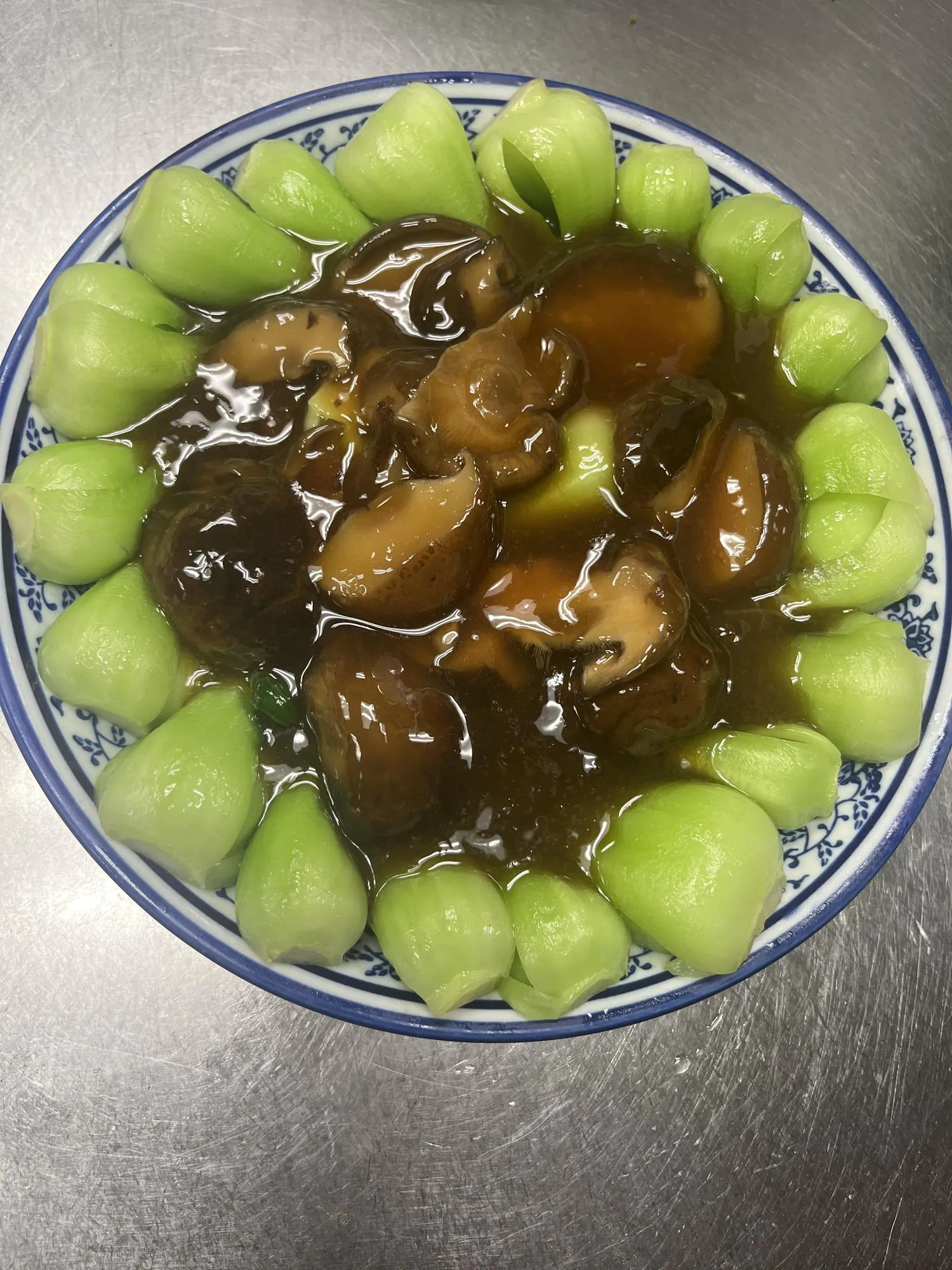 Braised mushrooms in oyster sauce surrounded by bok choy florets at ShangWei Szechuan, a Chinese Restaurant in Bethlehem