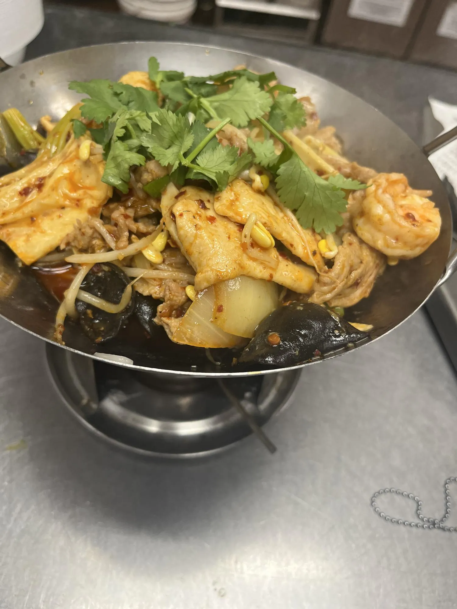 Spicy hot pot with pork, shrimp, bean sprouts, wood ear, and cilantro at ShangWei Szechuan, a Chinese Restaurant in Bethlehem